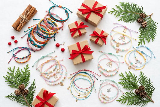 Aesthetic holiday stocking stuffer gift flat-lay featuring handcrafted cord bracelets and small gift boxes