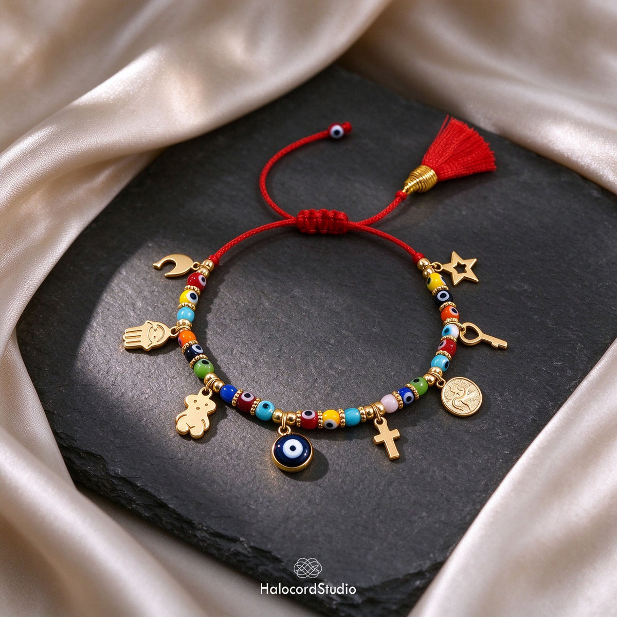 Spiritual evil eye red string protection bracelet with 8 lucky charms on black slate stone and champagne silk