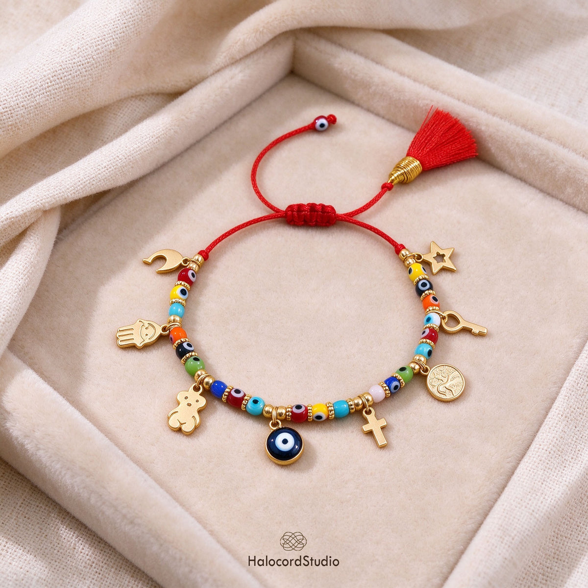 Handcrafted 8 amulets evil eye red string bracelet with tassel in jewelry tray by HalocordStudio