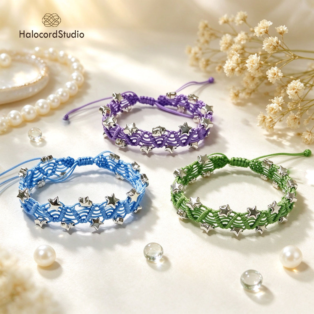 Three handmade star charm macrame bracelets in purple, sky blue, and sage green with silver star beads