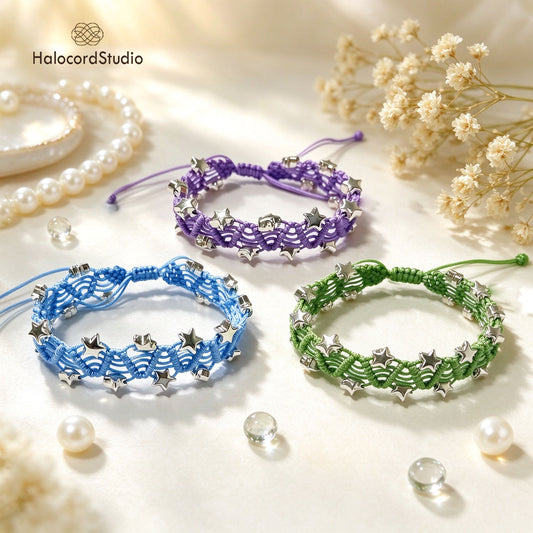 Three handmade star charm macrame bracelets in purple, sky blue, and sage green with silver star beads
